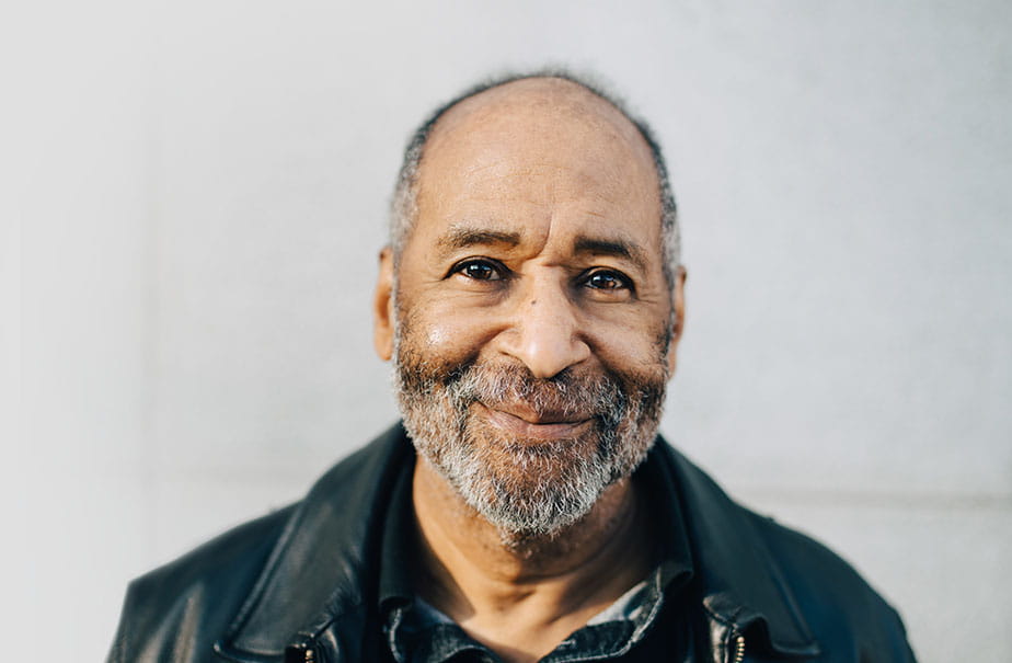 A man looking at the camera and smiling.