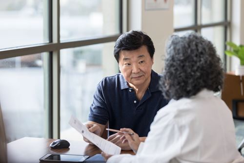 Patient reviewing test documentation with a healthcare provider.