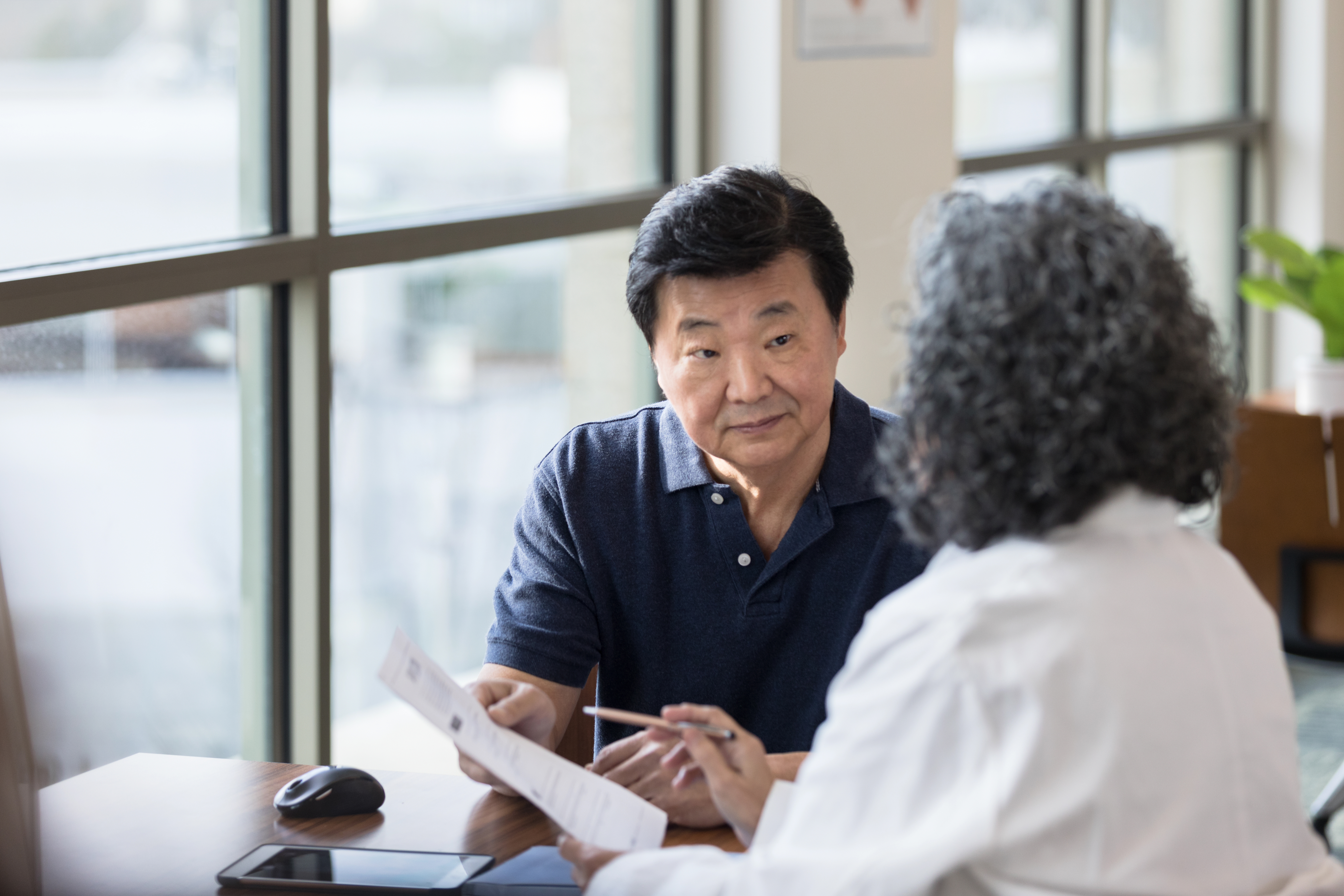Patient reviewing test documentation with a healthcare provider
