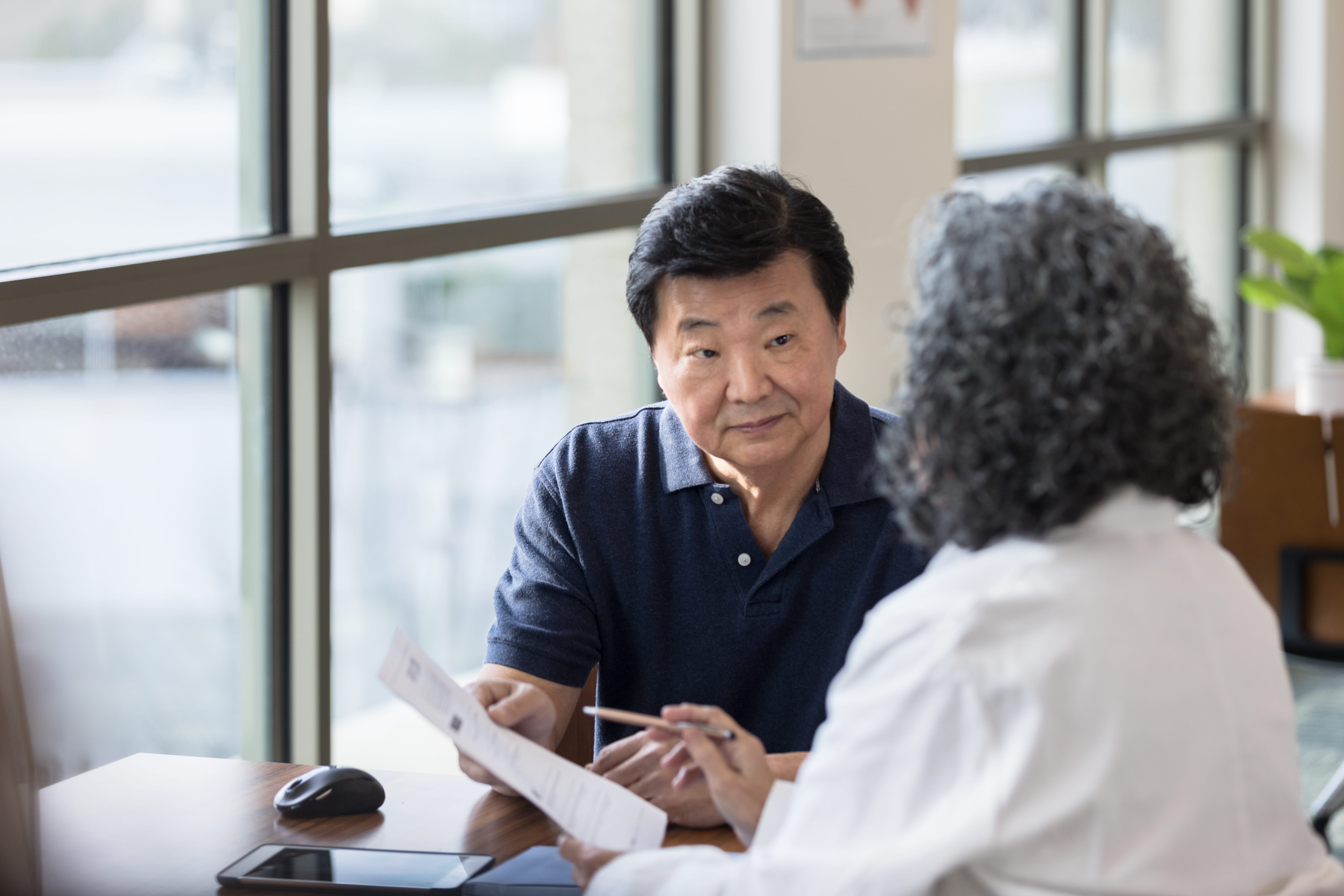 Patient reviewing test documentation with a healthcare provider.