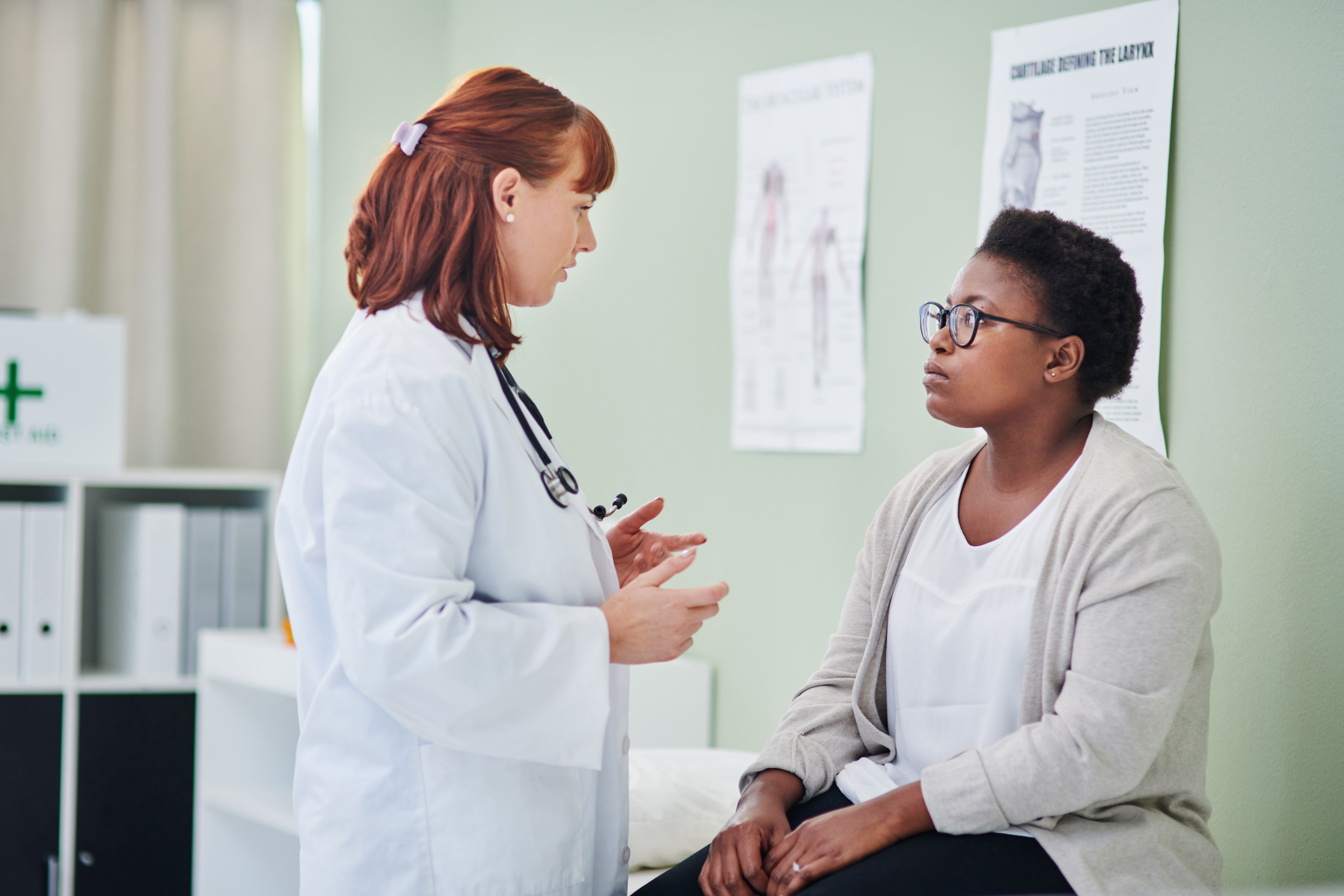 Female doctor speaking to a patient